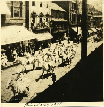 A group on horses ride down Main Street Grafton on Circus Day.