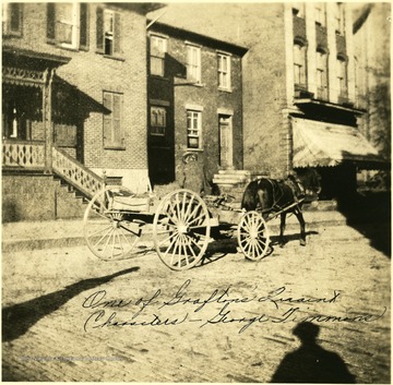 'One of Grafton's Quaint Characters,' George Timmons driving his horse and wagon down a street in Grafton, W. Va.