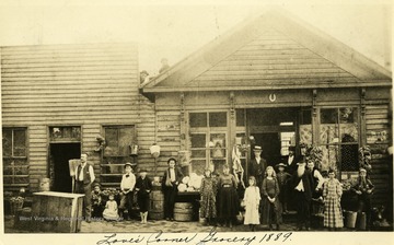 Group of people stand in front of the Love's Corner Grocery in Grafton, W. Va.