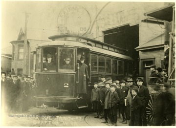 Group of people inside and around the First Streetcar out of Grafton, W. Va. 