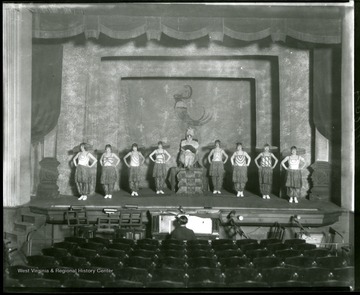Members of the LaSalle Musical Comedy Troupe of Grafton, West Virginia, in costume on stage.