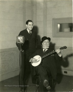 Rush D. Holt and watching Uncle Dave Macon of the Grand Ole Opry playing banjo.  