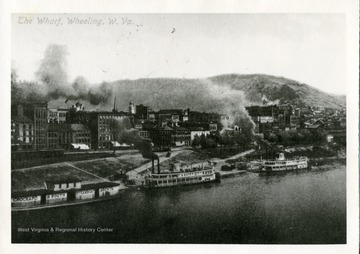 Steamboats along the shore of the Wharf district in Wheeling, W. Va.