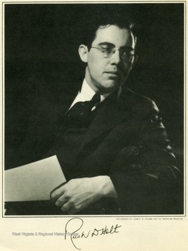 Portrait of Senator Rush D. Holt holding a paper.