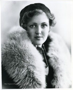 Portrait of a woman wearing a fur coat.