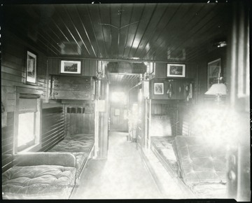Interior of Caboose showing beds and seating area on the B&amp;O railroad in Grafton, W. Va.  Sign in car reads 'Spitting on the Floor Prohibited.'