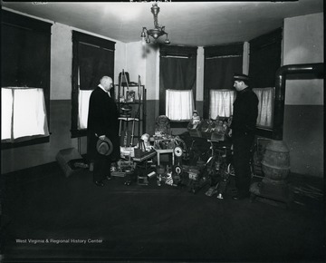Two men looking at toys for a Salvation Army toy drive, Grafton, W. Va.