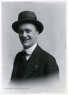 Men wearing a hat and a three-piece suit.
