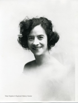 Portrait of a woman smiling.