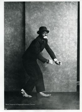 An African-American entertainer is dancing.