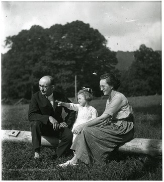 Olga Aegerter Holtkamp, Reverend Benjamin Holtkamp, and daughter, Grace, sitting down together, Helvetia, W. Va.
