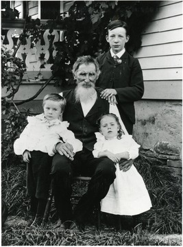 'David Kuenzler Sr. and children: Standing - David, Otto, and Frieda.'