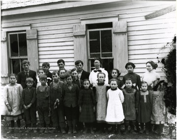 One older lady stands in the back row with children.