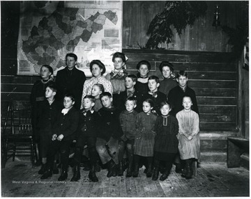 Group Portrait of Children Standing in Front of a W. Va. State Map