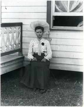 Women sitting, house in the background, Helvetia, W. Va.