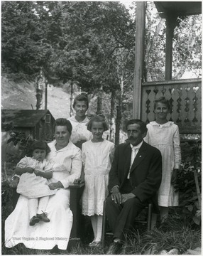 Teuscher family seated outside for a portrait at Helvetia, W. Va.
