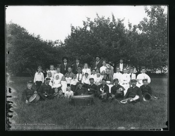 Members of the Helvetia Band with their instruments, gather outside for photograph.