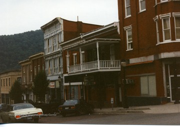 Cars parked along the street in front of downtown buildings in Hinton, West Virginia.