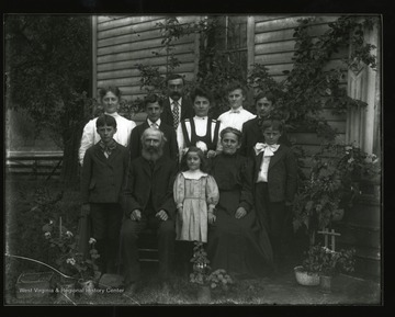 The Daetwyler Family poses for a group portrait outside their house in Helvetia, West Virginia.