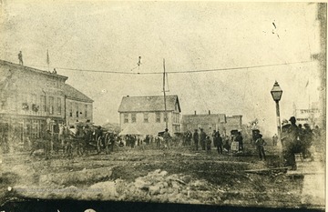 'Looking South West on 3rd Ave. from a point in front of the present Community Savings and Loan Bldg. The tent is S. E. corner of 9th St. and 3rd Ave.'