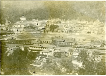 'Picture taken around the 1880.  I entered the Railroad service at this shop 1889. 1. McGrady house and pass station, 2. Train Dispatcher office also Adams Express Office, 3. Jackson River, 4. McDonald Home Geo. Forran married Miss Flora McDonald, 5. Round House, 6. Candlelight Church, 7. School House, 8. Methodist Church, 9. Freight Depot, 10. Eugist Home, 11. Company Road, 12. Scale House. The Bldg. with steeple No. 10 is Presbyterian Church; E.A. Murray."