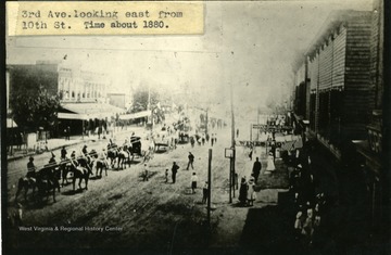 Parade of people and horses on '3rd Ave. looking east from 10th St.'