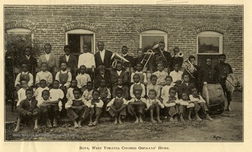 Group portrait of boys living at West Virginia Colored Orphan's Home in Huntington, West Virginia.  Some are holding musical instruments.