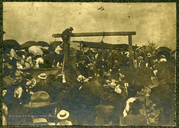 Large group of people gathered around a wooden structure, Lewisburg, W. Va.
