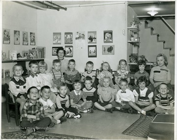 Young children sitting with their instructor in a classroom, Martinsburg, W. Va.