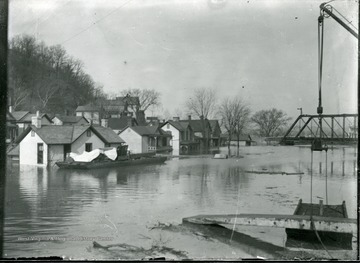 Flooded houses by a bridge, Parkersburg, W. Va.