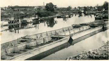 Boats and barges on the river.