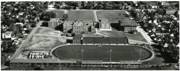 Aerial view of Parerksburg High School with football field right beside the school.