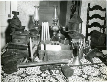 A group of antiques on a table.