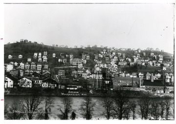 'Worker housing climbs up the hill of Seneca in the early 1900's, as the neighborhood grows around the glass factories.'