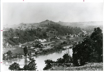 'The Mississippi Glass Factory in South Morgantown. Dorsey's Knob can be seen in the background.'