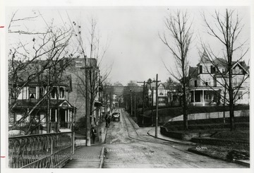 Inscribed on the photograph; 'A view down Beverly Avenue (now the intersection of University and Stewart), taken around 1910, shows a quiet sunnyside of one family dwellings. Beverly Avenue is now University Avenue at Stewart Street.'