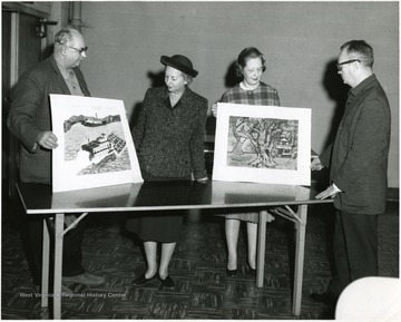 From left to right: Dr. John Clarkson, Dr. Barbara Drianer, unknown, and Wilbur Bauer.