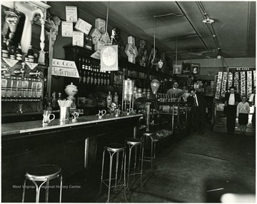 Interior of a drugstore, children standing by the cashier, Morgantown, W. Va.