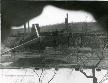 Factory in Morgantown, W. Va. Perhaps 'Ordnance Works'. Across the river. 