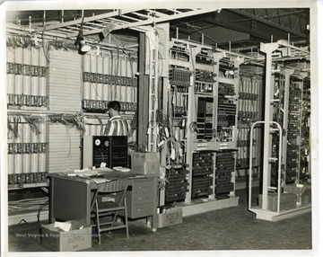 An employee is working at the new Telephone Exchange in Morgantown, West Virginia.