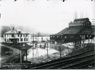 Flood hits several buildings at the U.S. Window Glass Factory, No. 1 in Morgantown, West Virginia. The glass factory is located near railroad tracks. 