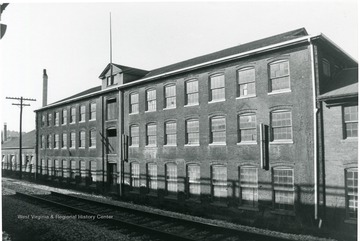 'Original woolen mill portion of building view facing west along Rail Road.' 