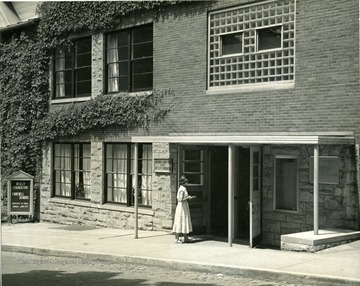 A female student enters the Wesley Foundation.