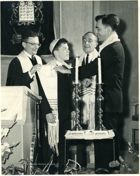 Hugh David and others performing traditions of a Bar Mitzvah, Morgantown, W. Va.