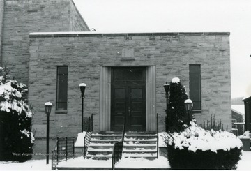 Main entrance of Tree of Life Synagogue located on South High Street in Morgantown, W. Va. Snow seen on walkway, ground, and bushes. 