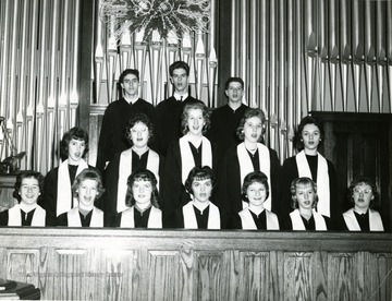 Some of the members include: front row:'Martha Jones, Francie Rowan, Dixie Casteel, Sharon Gregory, Dixie Downes, Nancy Maier, Barbara Adams'. Middle row: 'Lee Ann Fizer, Carolyn Devault, Susuan Field, Unknown, Patty Nine'. Back row: 'John Blosser, and Richard Ault, Unknown'. 