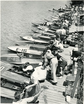 Boats are lined up against the dock.
