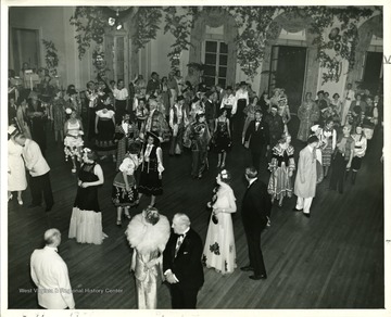 People are dancing at the Old White Fancy Dress Ball 'held annually during Old White Week.'