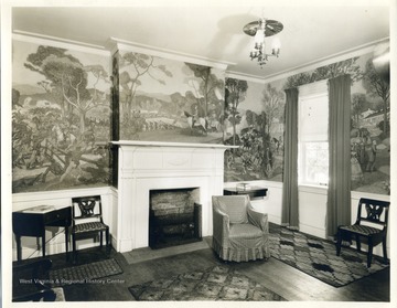 Interior of a room with a mural in one of the Greenbrier Hotel cottages.