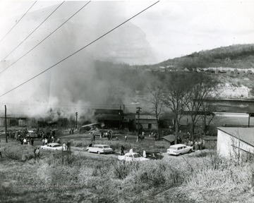 Crowds gather to watch the extinguishing of Glass Plant Fire in Star City near Morgantown, W. Va. 